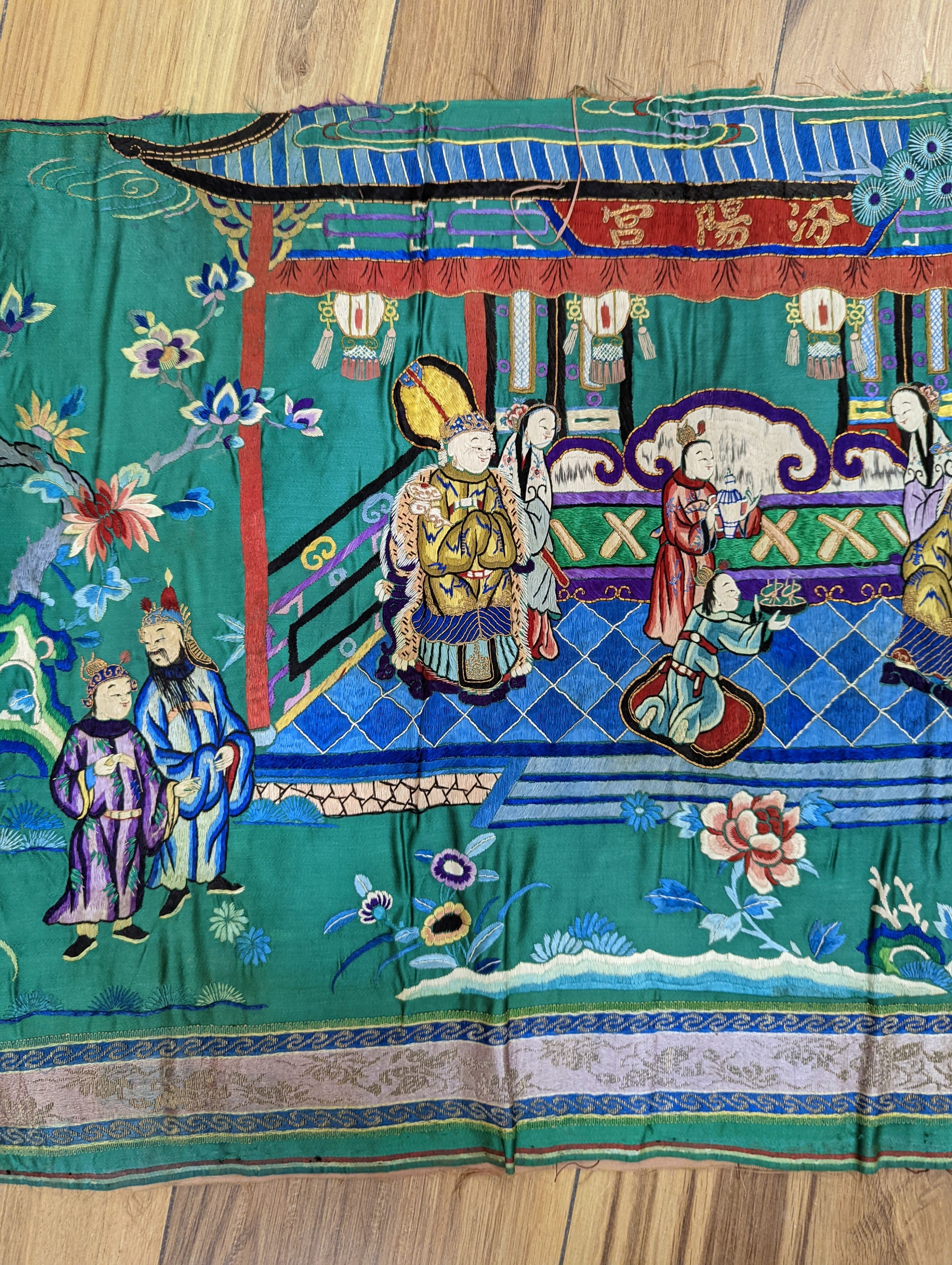 An early 20th century Chinese silk figurative embroidery from a larger panel of an emperor and empress scene.